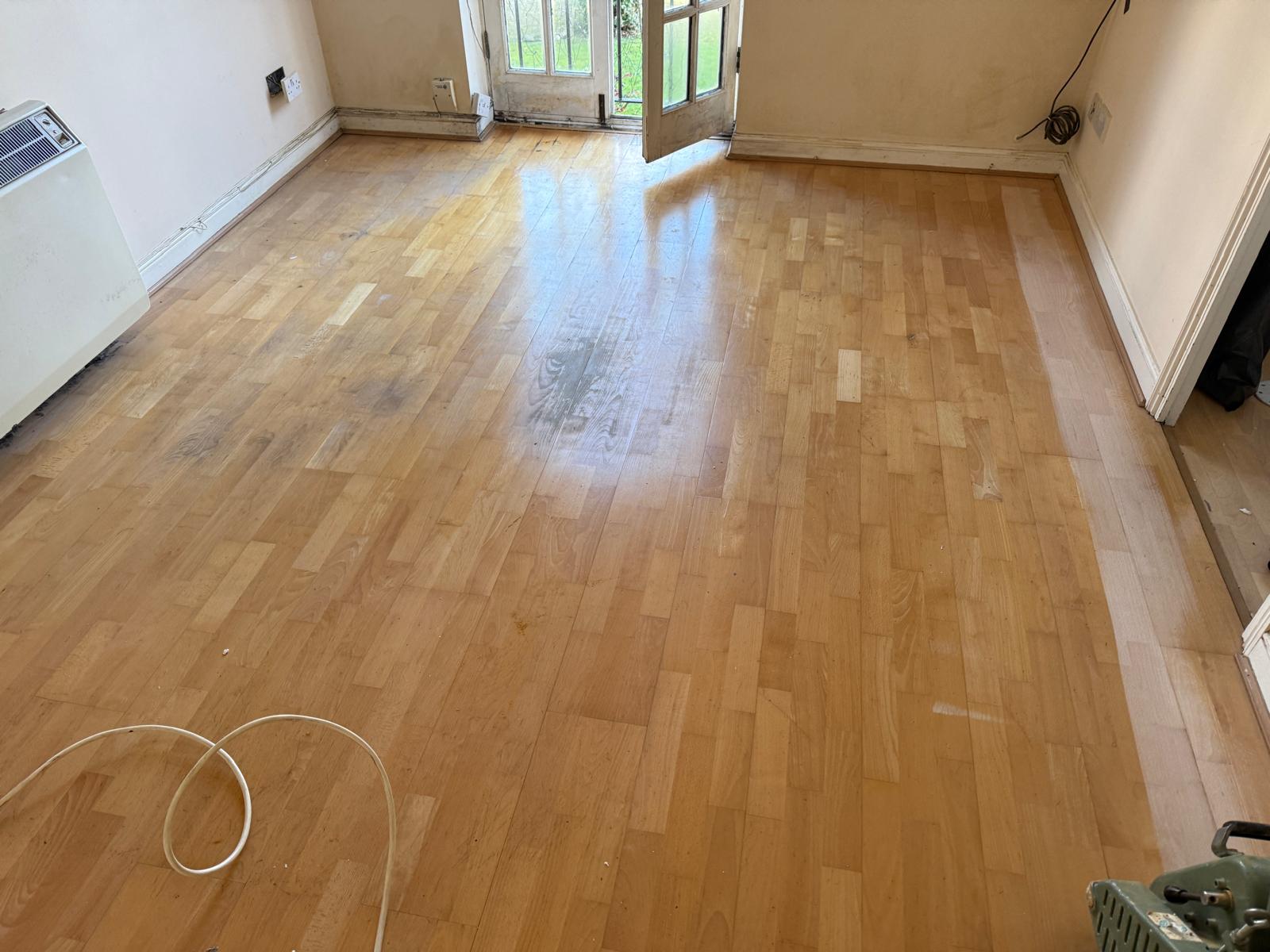 Parquet Floor Sanding in Surbiton showing a light wood block parquet floor before sanding and professional restoration